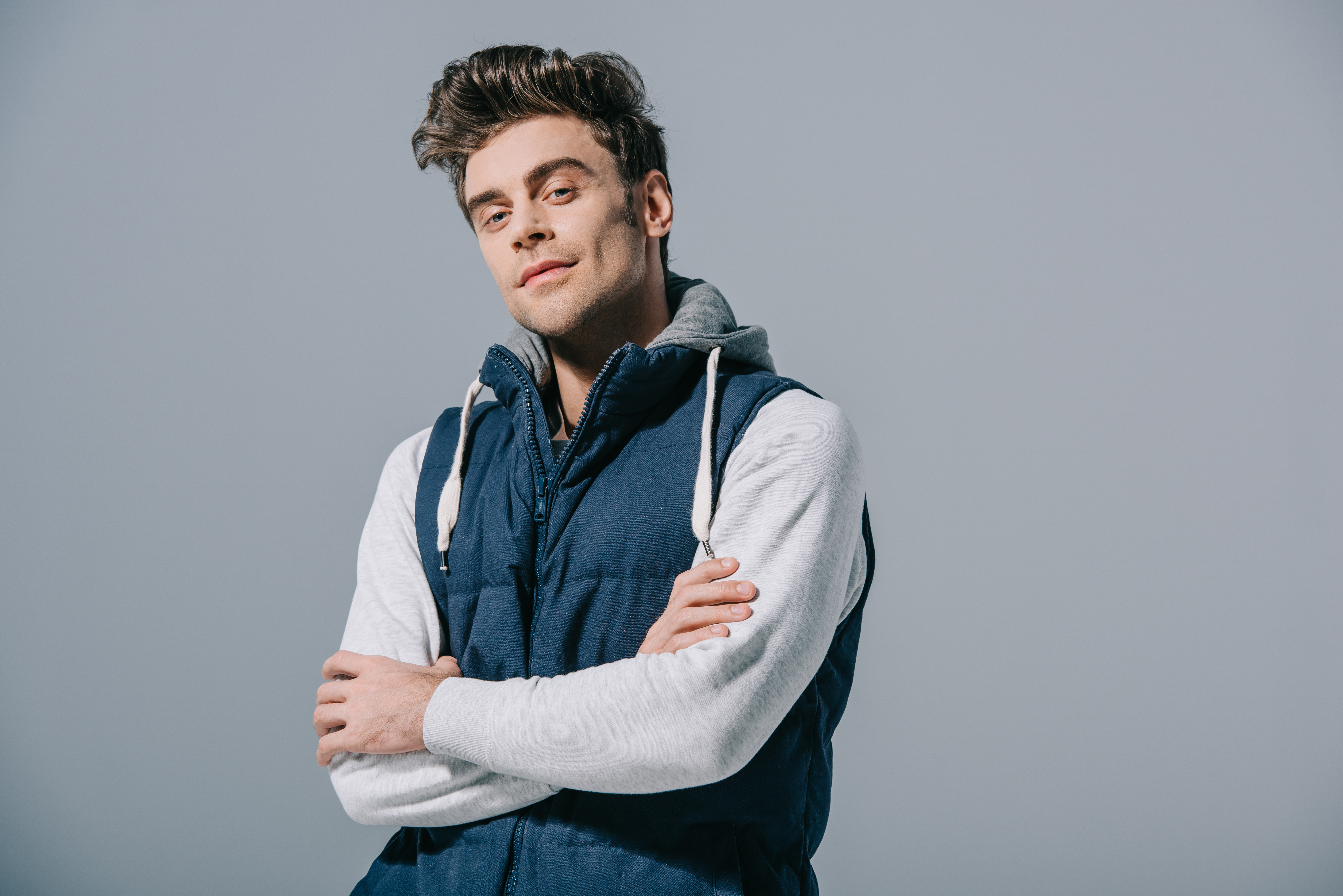 Vest worn under an open jacket